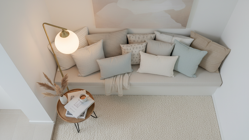 High angle view of a cosy living room corner with layered cushions and a vintage lamp