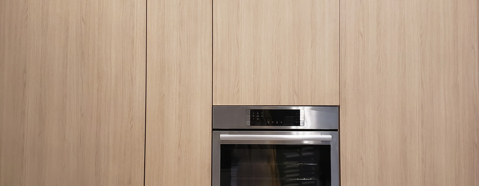 Misaligned kitchen tall unit doors that need readjustment.