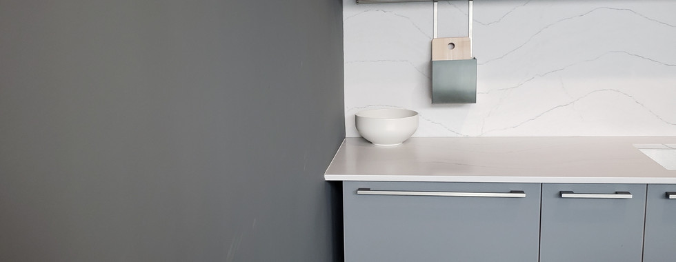 Extra space between kitchen walls & cabinets due to missing filler panel.