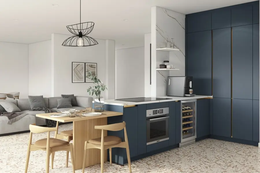 Dark blue modern European kitchen with peninsula layout, quartz countertops, integrated dining table, handleless-style cabinetry, and open-plan living connection.