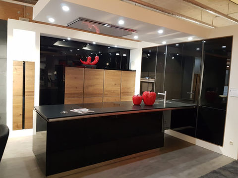Black glass kitchen with peninsular.