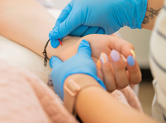 Dr. Angel Santos providing acupuncture treatment at LIFT Collective