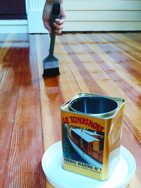 Applying Linseed Oil Varnish on a porch floor