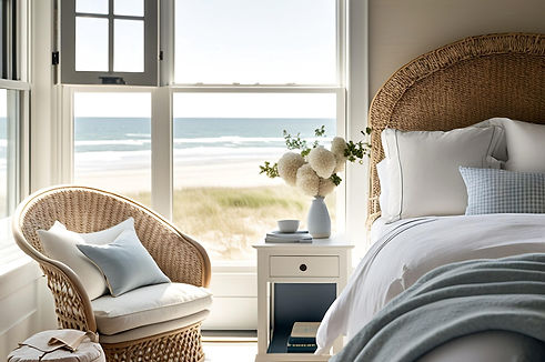 Beautiful bedroom with a corner window view of beach and ocean