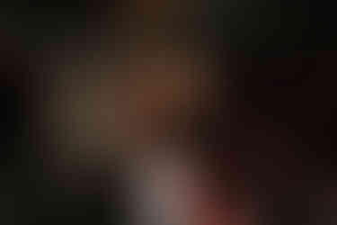 man dancing on stage at wedding