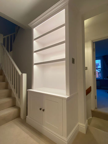 Bespoke Shaker style alcove unit with integrated LED lighting, designed and installed by New Heights Carpentry in a client’s hallway in Reigate, Surrey.