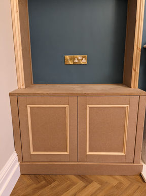 Shaker style twin alcove units with soft-closing doors installed by New Heights Carpentry in a refurbished home in Reigate, Surrey.