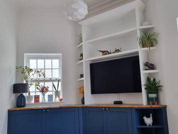 Bespoke TV Media Unit Featuring Desk with Signature Pivot Doors Custom Shelving and Cupboards for Storage for a Customer in Rochester Kent