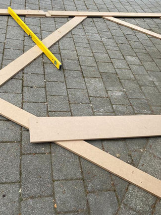 Bespoke Under-Stairs Storage with Pull-Out Shoe Drawer Hanging Rail Shelving and Wine Rack for a Client's Hallway in Reigate Surrey by New Heights Carpentry