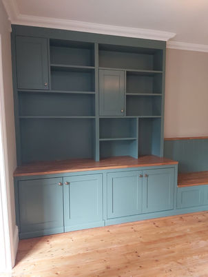 Bespoke Shaker style alcove unit with seating bench and pivot sliding doors in Guildford, Surrey, by New Heights Carpentry