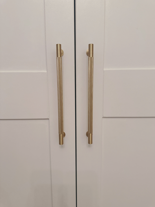 Shaker style fitted wardrobe featuring bespoke shelving, drawers and hanging rails by New Heights Carpentry in Reigate, Surrey. Custom-built for functional and stylish storage.