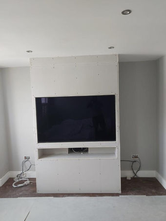 Bespoke TV Media Unit with Twin Alcove Units, Custom Shelving and Central Media Opening by New Heights Carpentry in Reigate Surrey