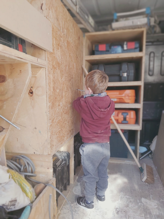 Carl’s son learning carpentry skills in the workshop, the little apprentice at New Heights Carpentry