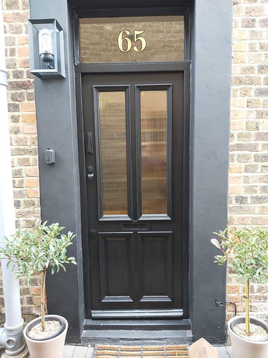 Custom timber front door installation and fitment in Reigate by New Heights Carpentry