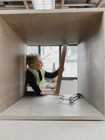 Carl’s son learning carpentry skills in the workshop, the little apprentice at New Heights Carpentry