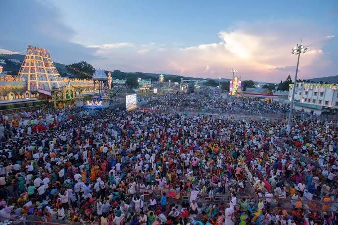  This image depicts the grandeur of a spiritual gathering at a revered Indian temple, highlighting the deep-rooted faith and cultural unity that define the essence of dharmic traditions