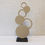 Thumbnail: Handmade wooden circle sculpture with concrete finish, featuring interconnected circles in beige and natural wood tones, mode