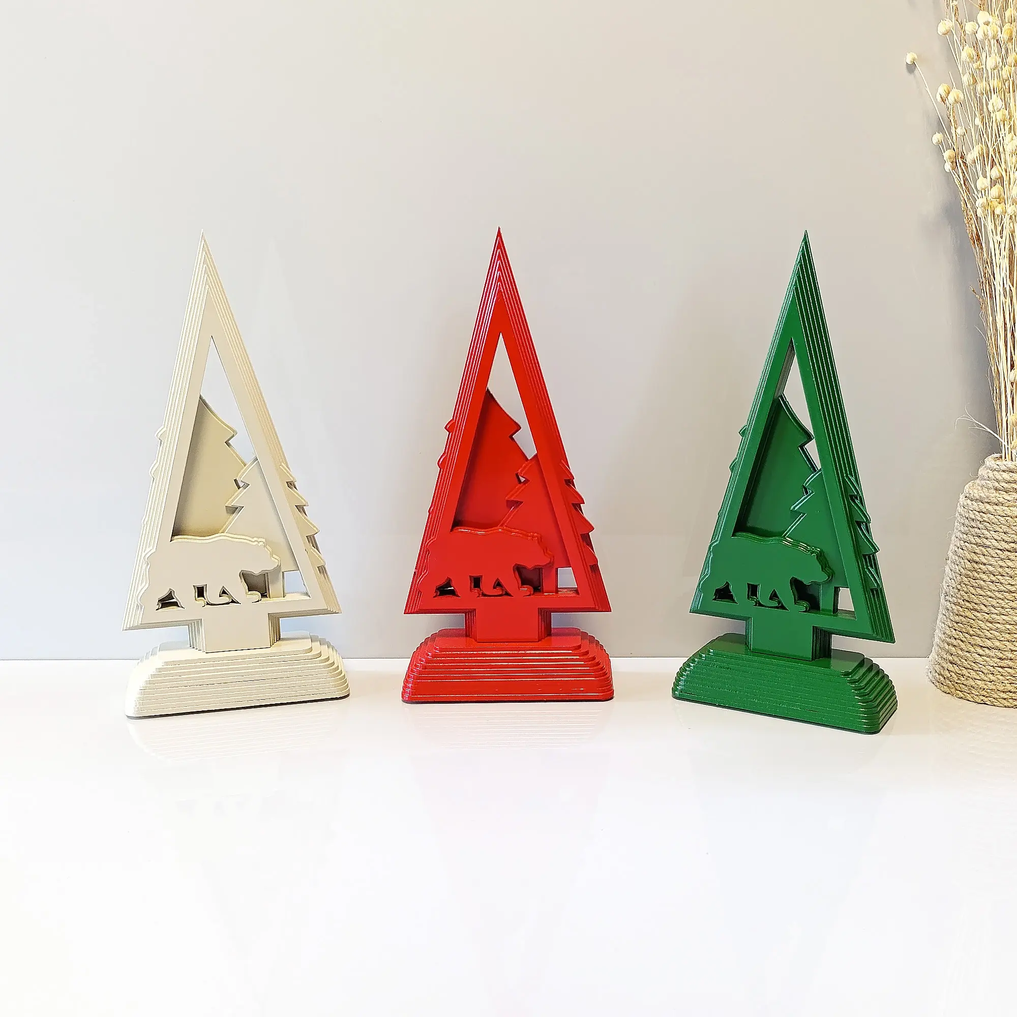 Rustic wooden Christmas tree ornament with bear silhouette in red, green, and white — handcrafted holiday décor.