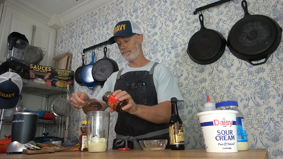 Creating a homemade chipotle burger sauce with diced chipotles in adobo, carefully mixed in a cozy kitchen setting.