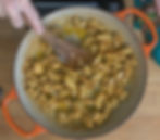 Sizzling pieces of chicken are being expertly browned in preparation for a creamy chicken stroganoff.