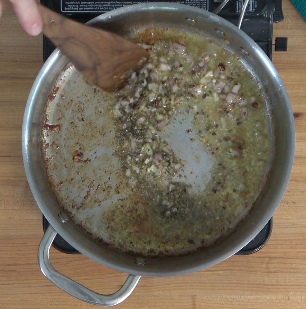 Aromatic shallots and spices sizzle in a pan, creating the flavorful base for a delectable marry me chicken sauce.