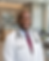 Dr. Archer in white coat and stethoscope smiling in clinic — Leonidas Vitality men's health and optimization physician