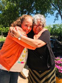 two friends hugging.