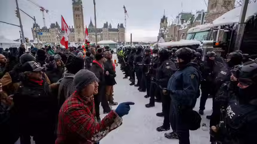 Canadian police and demonstrators during a public protest in Ottawa reflecting tensions surrounding democratic expression and civic discourse