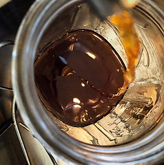pouring tincture.jpeg