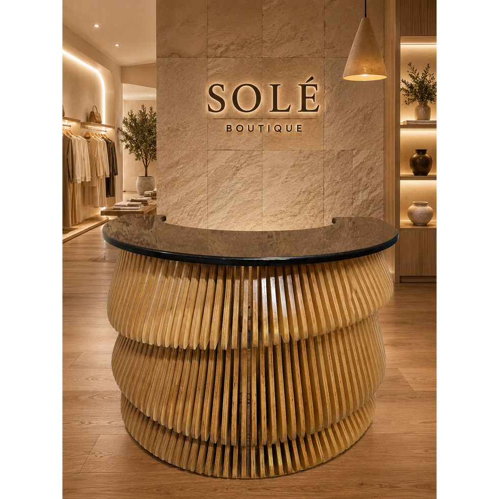Modern desk with a sculptural parametric wood design and black countertop, creating an elegant focal point in a warm