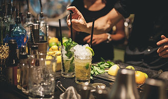 Bartender prepares cocktails.