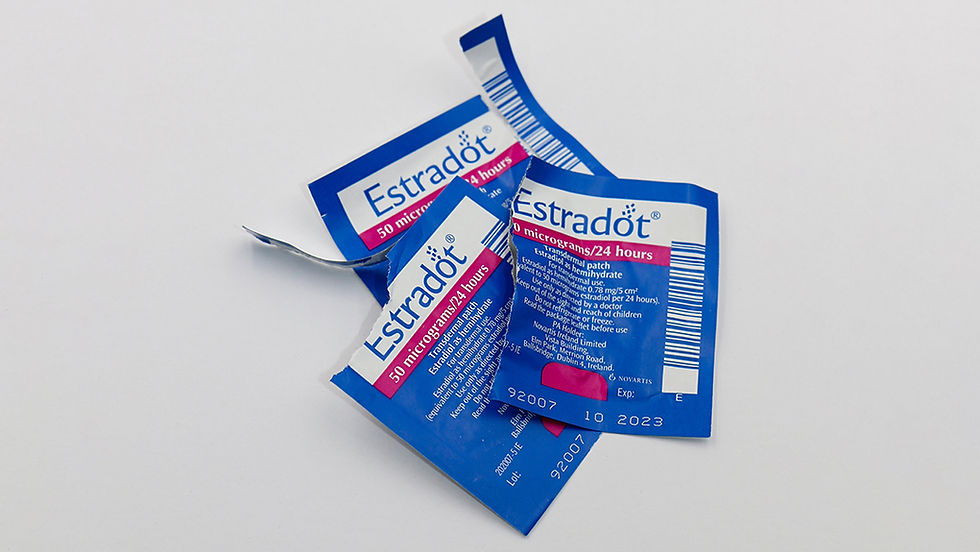 Empty Estradot estrogen packets sitting on a table