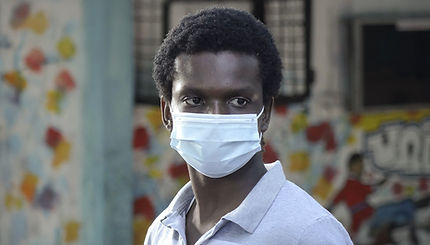 A Black man wearing a face mask 