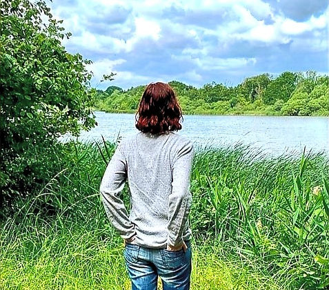 Person looking at view of lake