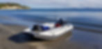 T420LX Inflatable Boat with fishing gear loaded on the beach