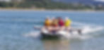 T380LX Inflatable Boat with family and SUP on the water
