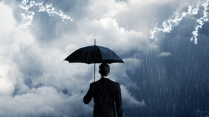 Business executive standing under an umbrella in a thunderstorm, symbolizing resilience, inner stability, and calm leadership under pressure