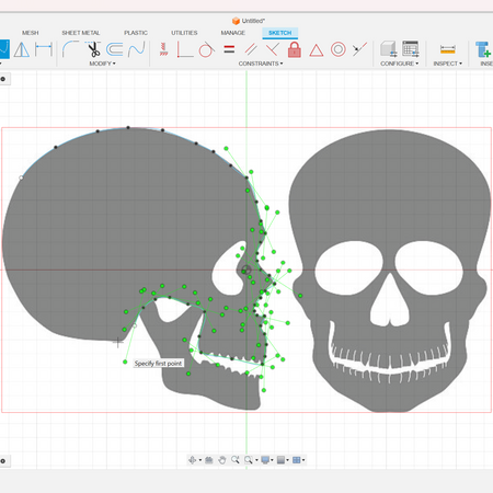 Tracing the skull shapes using the spline tool over the canvas.