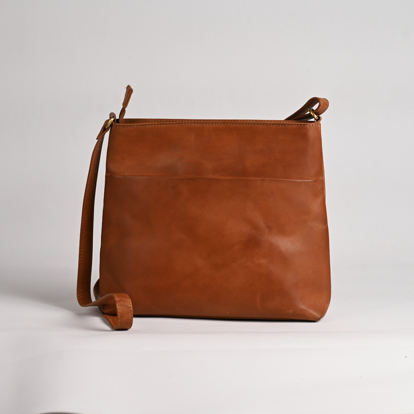 Brown leather shoulder bag isolated on white background, stylish fashion accessory