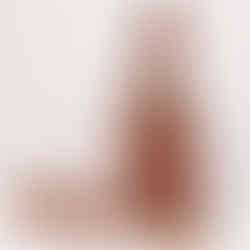 Brown leather handbag with shoulder strap on white background, elegant design.