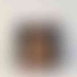 Black leather tote bag with colorful pattern and open zipper