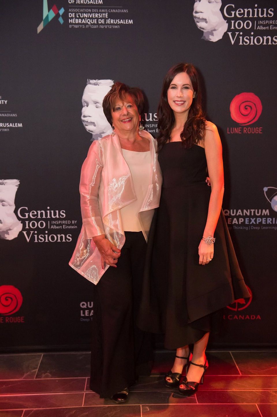 Tori Avey Levy next to a woman. Both are smiling.