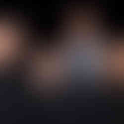 A group of four people smiling for a picture.