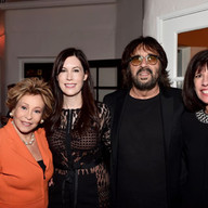 Shuki Levy and Tori Avey Levy with two other people smiling for a picture.