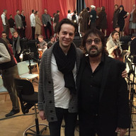 Shuki Levy with another person smiling for a picture.