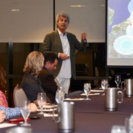 A man speaking about his presentation