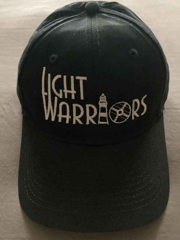 Black baseball hat with Light Warriors logo and lighthouse