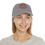 Thumbnail: Woman smiling, wearing gray baseball cap with logo