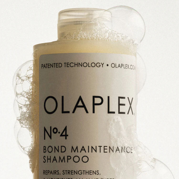 Olaplex No. 4 Bond Maintenance Shampoo with soapy bubbles