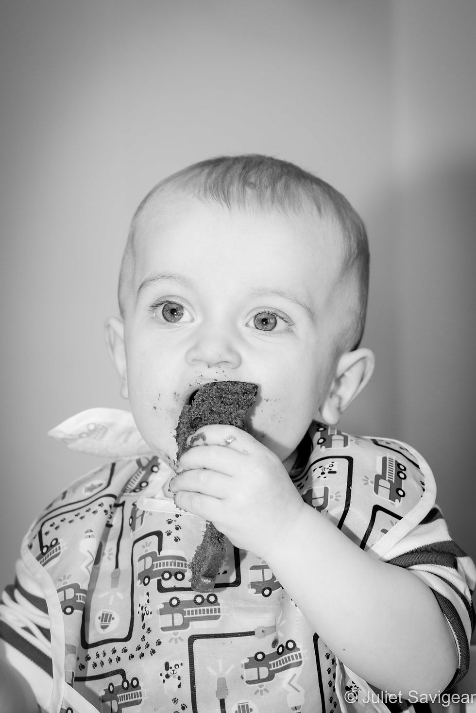 Baby eating birthday cake
